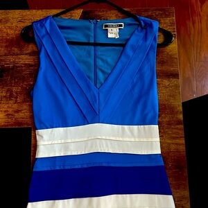 Dress worn only once. Has a very small pen stain (notes in photos).